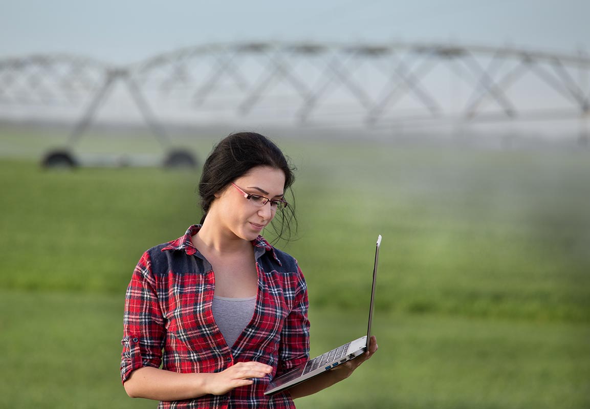 Woman using Aquarius Farm Controls